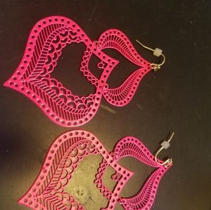 a pair of hot pink baked enamel earrings